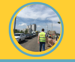 Ukraine construction a photo of a worker from CoST Ukraine’s assurance work with orange and blue detailing around the image